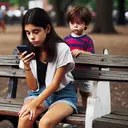 An engrossed Hispanic teenage girl is sitting on a wooden park bench, her focus entirely on her smartphone which she holds in her hands. She's immersed in an online realm, oblivious to her surroundings. A few steps away, a young Caucasian child stands, his confusion apparent on his small and innocent face. He's in his colorful summer outfit and seems to be in need of attention, perhaps he's forgotten and left standing amidst the hustle and bustle of the park.